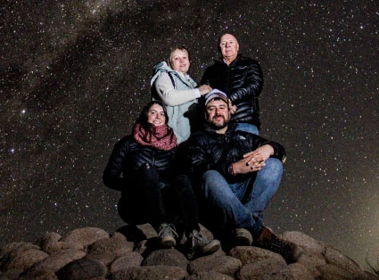 Astrophotography of a family in the atacama desert