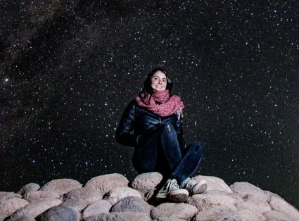 Astrophotography of a woman in the atacama desert