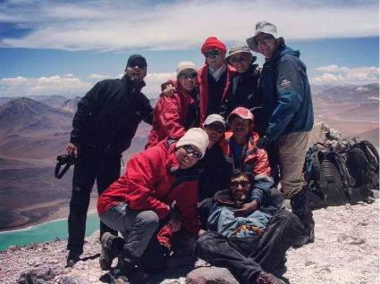 Group of 9 mountaineers on the summit of Licancabur Volcano